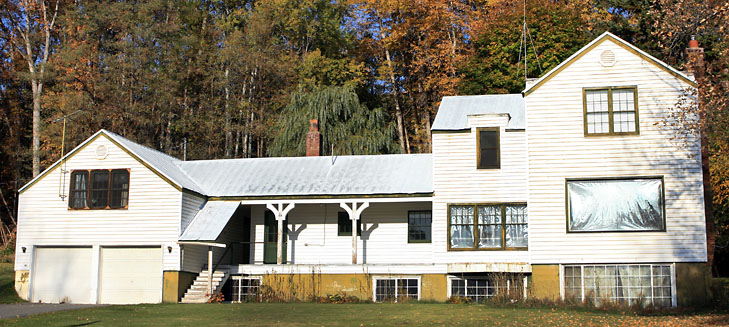 photo of large, old white house