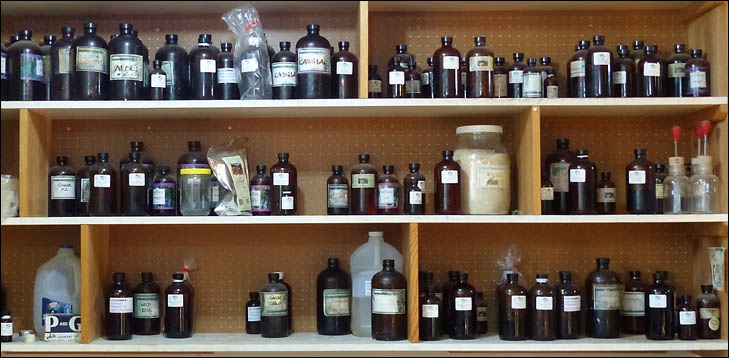 shelf full of brown bottles
