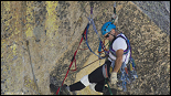 climbers suspended on ropes